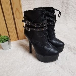 New black faux leather stiletto boots.